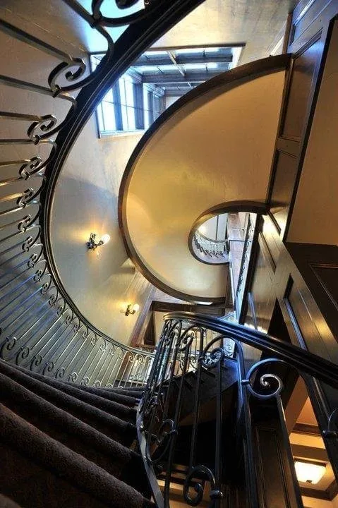 Curved custom stairway by TG Woodworking