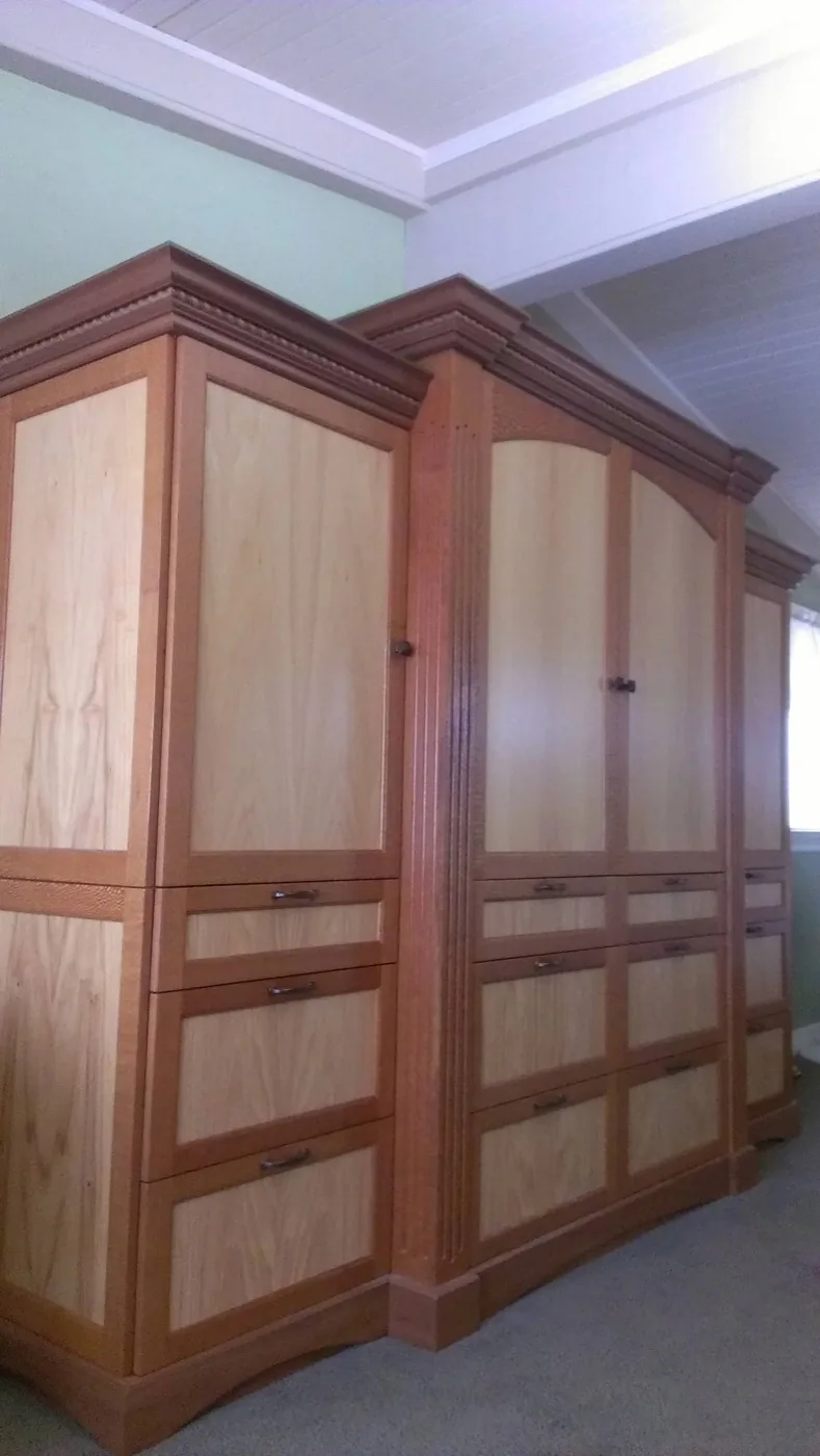Custom wooden wardrobe cabinetry by TG Woodworking